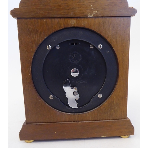 222 - A 20thC Garrard & Co mantel timepiece, in a gilt metal mounted, simulated mahogany case; the Ell... 