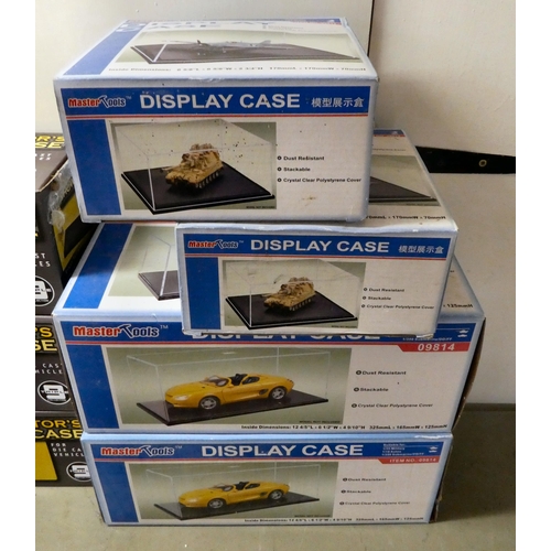 226 - Clear plastic empty model display cases: to include examples by Academy and Master Tools