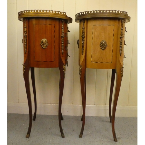 24 - A pair of modern Louis XVI design, marquetry and ormolu mounted, three drawer side tables of cylinde... 