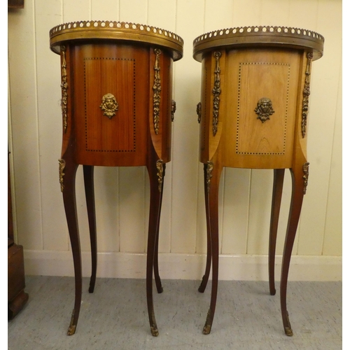 24 - A pair of modern Louis XVI design, marquetry and ormolu mounted, three drawer side tables of cylinde... 