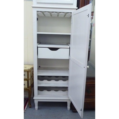 30 - A modern white painted cabinet, fashioned as a longcase clock with two doors, raised on square, tape... 