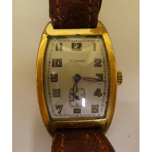 350 - A Nivada gold plated cased wristwatch, faced by an Arabic dial with subsidiary seconds, on a brown h... 