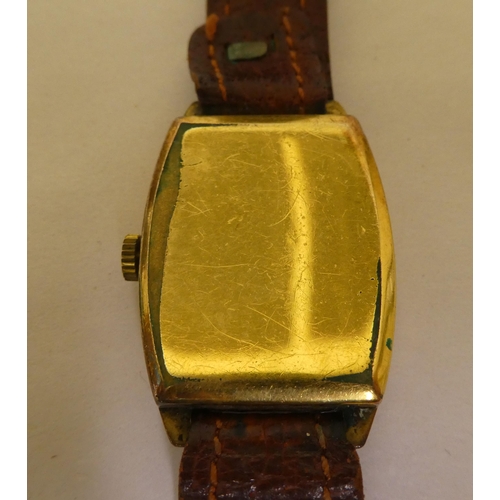 350 - A Nivada gold plated cased wristwatch, faced by an Arabic dial with subsidiary seconds, on a brown h... 