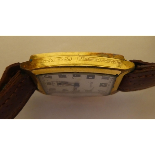 350 - A Nivada gold plated cased wristwatch, faced by an Arabic dial with subsidiary seconds, on a brown h... 