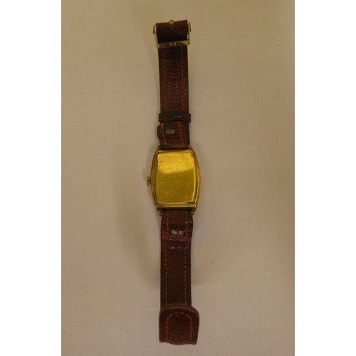 350 - A Nivada gold plated cased wristwatch, faced by an Arabic dial with subsidiary seconds, on a brown h... 