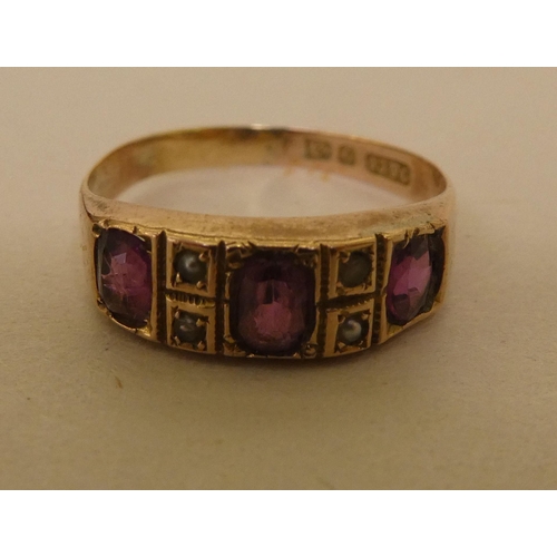 354 - A 9ct gold ring, set with purple stones and pearls