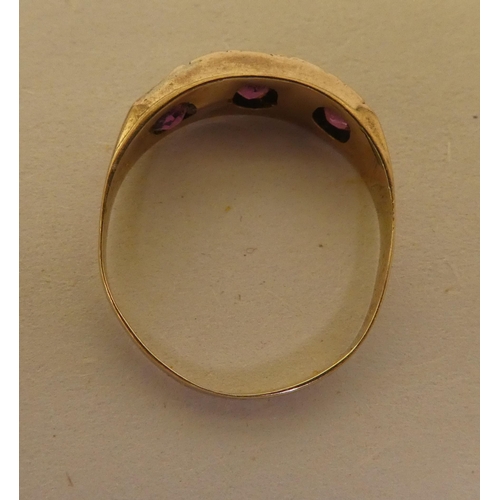 354 - A 9ct gold ring, set with purple stones and pearls