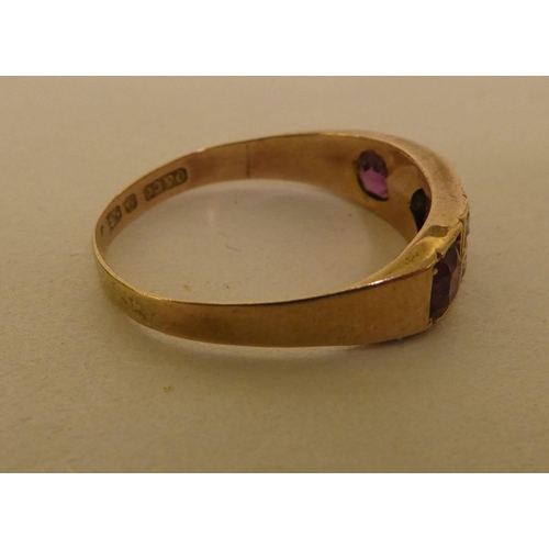 354 - A 9ct gold ring, set with purple stones and pearls