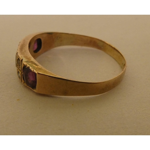 354 - A 9ct gold ring, set with purple stones and pearls