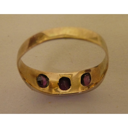 354 - A 9ct gold ring, set with purple stones and pearls