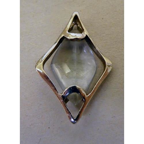 358 - A white metal pendant (probably 9ct gold), set with a marquise cut quartz