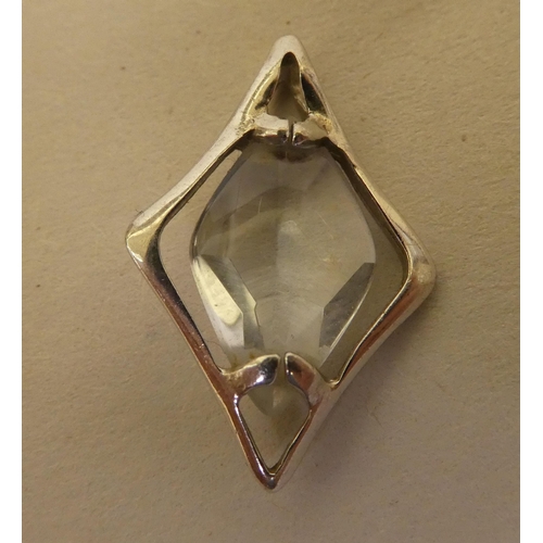 358 - A white metal pendant (probably 9ct gold), set with a marquise cut quartz