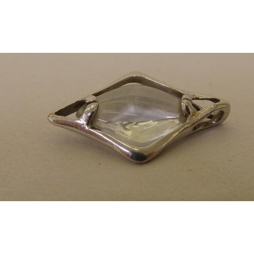 358 - A white metal pendant (probably 9ct gold), set with a marquise cut quartz