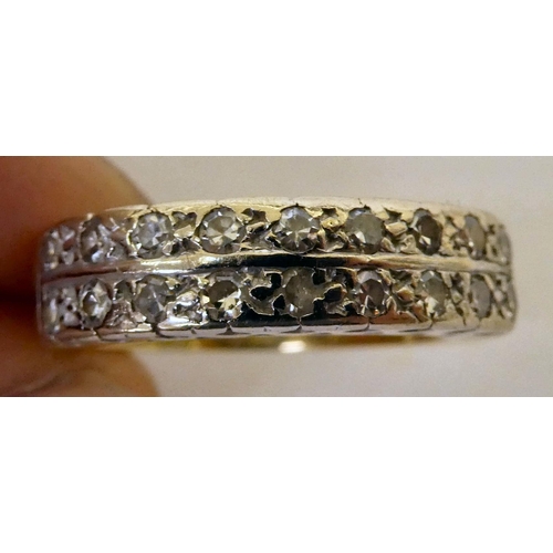 363 - An 18ct gold ring, set with two bands of diamonds