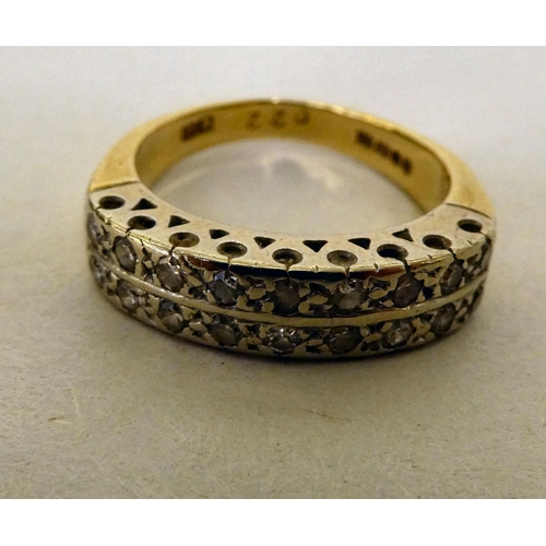 363 - An 18ct gold ring, set with two bands of diamonds