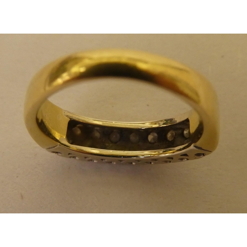 363 - An 18ct gold ring, set with two bands of diamonds