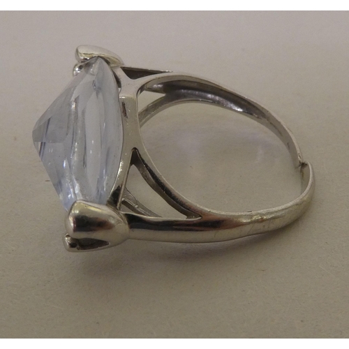 364 - A white metal (probably 9ct gold) ring, set with a marquise cut quartz