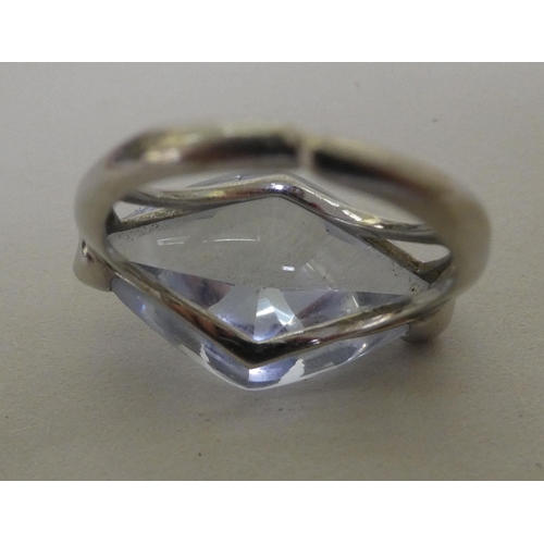 364 - A white metal (probably 9ct gold) ring, set with a marquise cut quartz