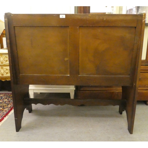 37 - A modern oak bench with a panelled back, raised on styled platform ends  39