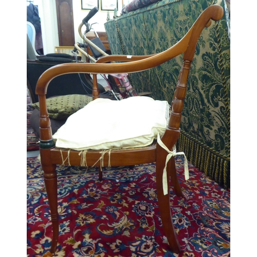 38 - A modern Regency design mahogany, overpainted open arm chair with a caned panel back and similar sea... 