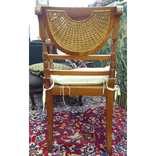 38 - A modern Regency design mahogany, overpainted open arm chair with a caned panel back and similar sea... 