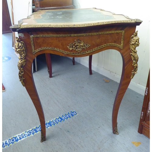 4 - A modern Louis XV design ormolu mounted desk, the serpentine front over three frieze drawers, raised... 