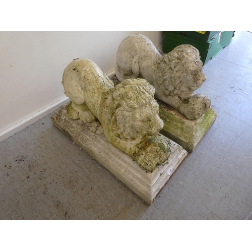 40 - A pair of composition stone garden statues, recumbent lions  17