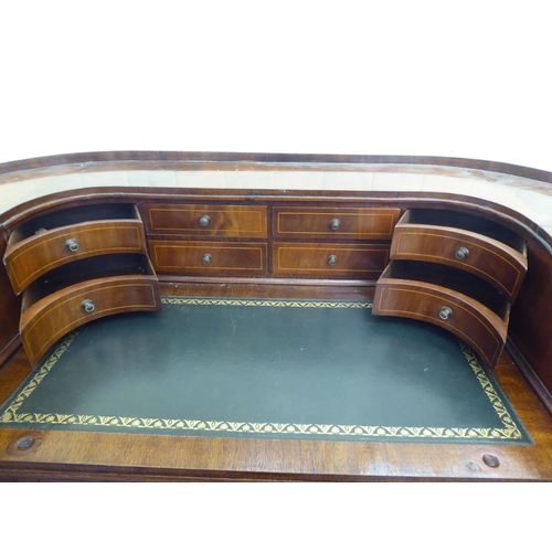 43 - A modern Carlton House design mahogany finished desk, raised on square, tapered legs  38