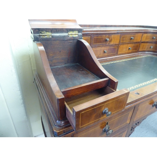 43 - A modern Carlton House design mahogany finished desk, raised on square, tapered legs  38