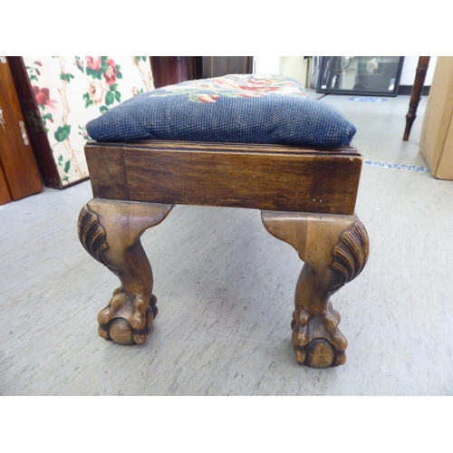 48 - A 1930s walnut stool with a tapestry upholstered top, raised on cabriole legs  50