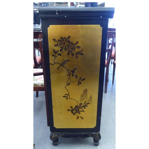 52 - A modern Chinese black lacquered, overpainted two door cabinet, on stubby cabriole feet  42.5