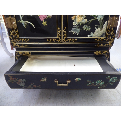 57 - A modern Chinese black lacquered, painted and hardstone inlaid Chinese cabinet, decorated with birds... 