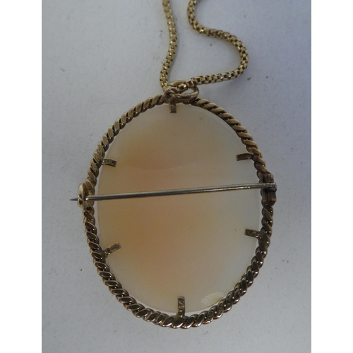 6 - A yellow metal mounted, shell carved cameo pendant, on an 18ct gold chain