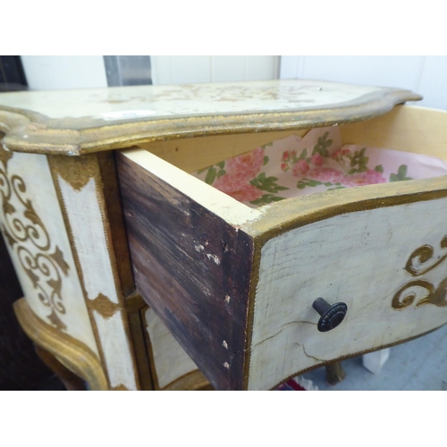 60 - A modern gilt and cream painted, serpentine front, two drawer bedside chest, raised on cabriole legs... 