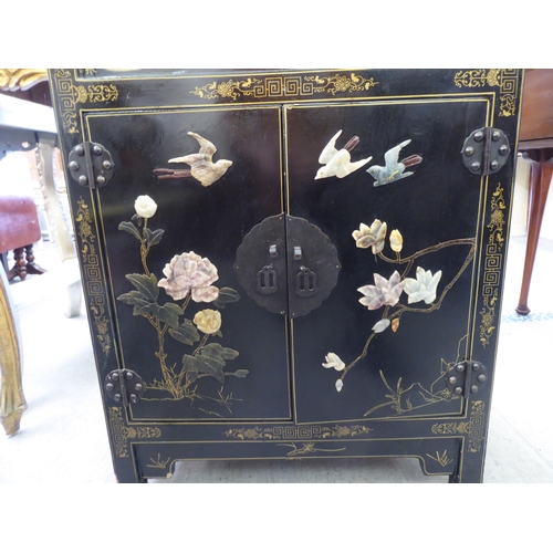 62 - A modern Chinese black lacquered, painted and hardstone inlaid cabinet  comprising an open shelf, ov... 