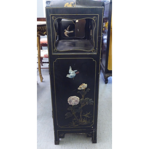 62 - A modern Chinese black lacquered, painted and hardstone inlaid cabinet  comprising an open shelf, ov... 