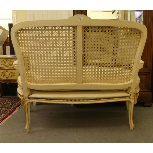 64 - A modern cream and gilt painted two person salon settee, raised on cabriole legs  49