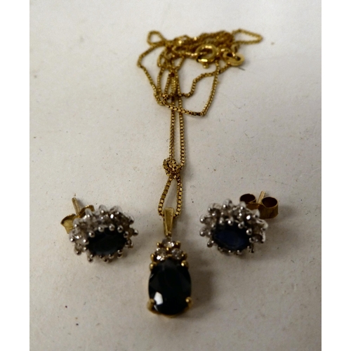 75 - 9ct gold jewellery, set with sapphires and diamonds, viz. a pendant necklace and a pair of earrings