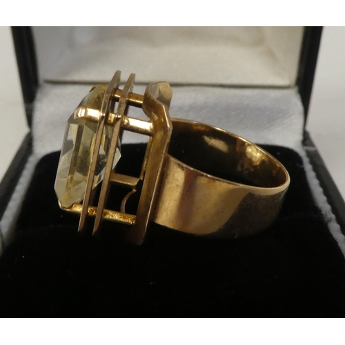 79 - A gold coloured metal ring, set with a citrine coloured stone  stamped 585  boxed