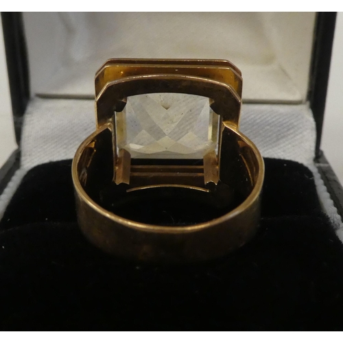 79 - A gold coloured metal ring, set with a citrine coloured stone  stamped 585  boxed