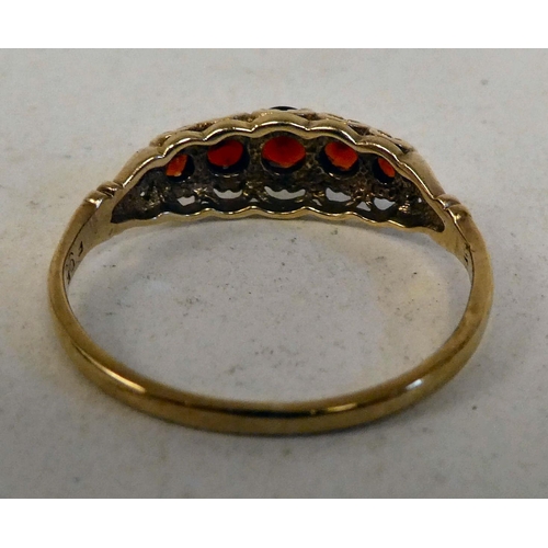 86 - A 9ct gold ring, set with a row of garnets