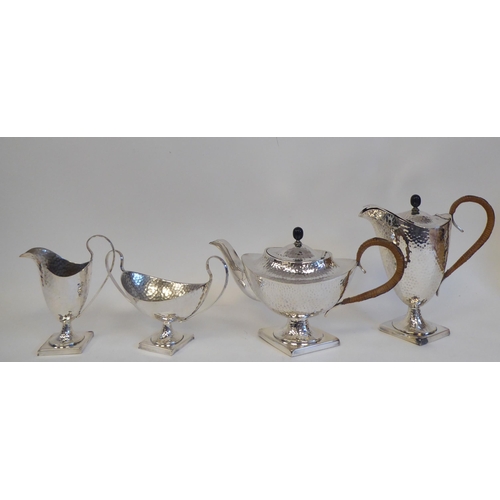 88 - A 20thC silver plated spot-hammered pedestal tea set