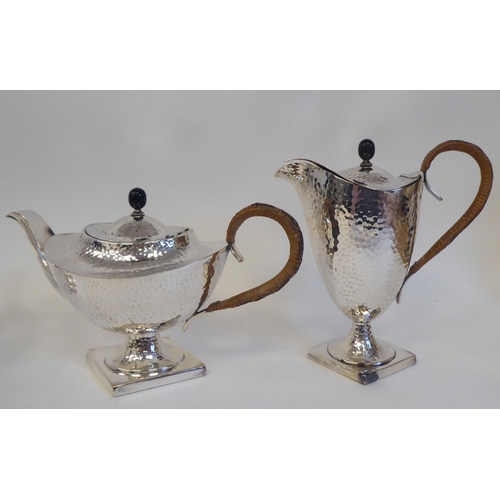 88 - A 20thC silver plated spot-hammered pedestal tea set