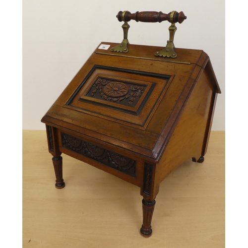 98 - An Edwardian mahogany purdonium of angular form with brass mounts and a carved, panelled, hinged lid... 