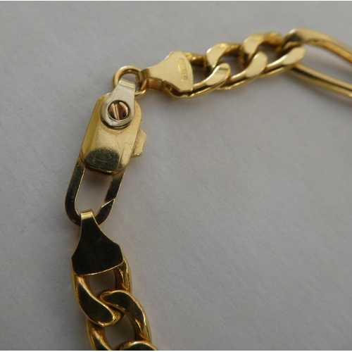 1 - An 18ct gold curb link bracelet