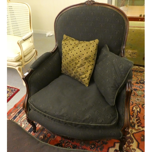 110 - A modern Louis XV design mahogany framed salon chair, upholstered in a black floral fabric, raised o... 