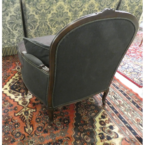 110 - A modern Louis XV design mahogany framed salon chair, upholstered in a black floral fabric, raised o... 