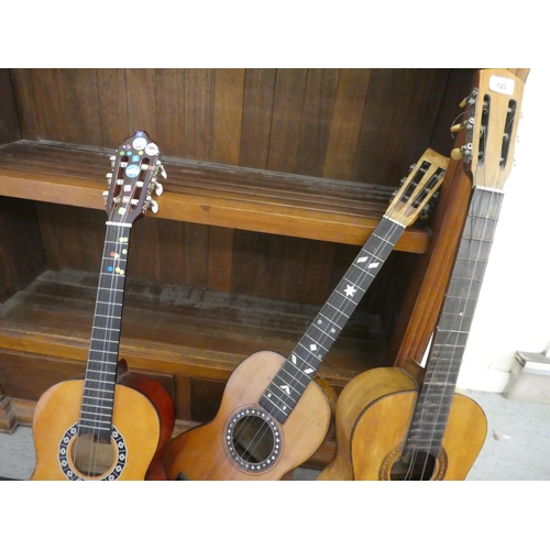 120 - Three similar guitars, in pine, fruitwood and mahogany