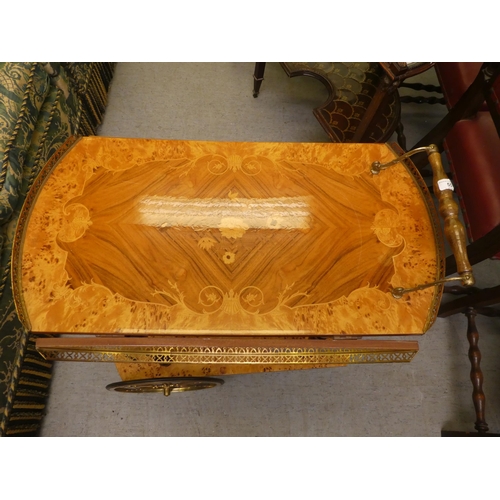 55 - A modern Italian marquetry decorated, two tier tea trolley  29