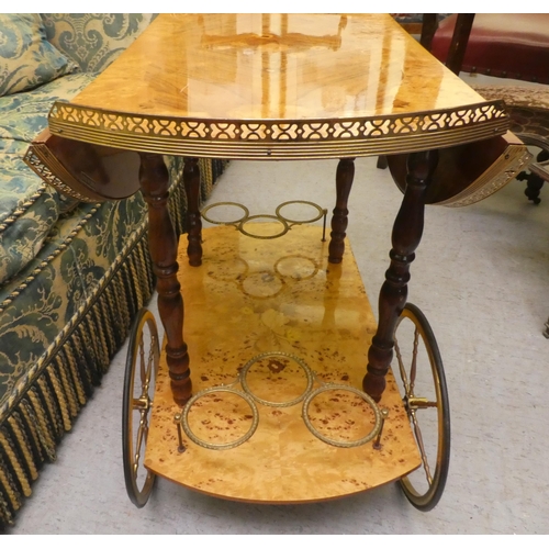 55 - A modern Italian marquetry decorated, two tier tea trolley  29